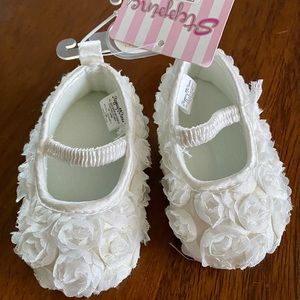 NWT!  Never worn white flower infant slip-ons.
